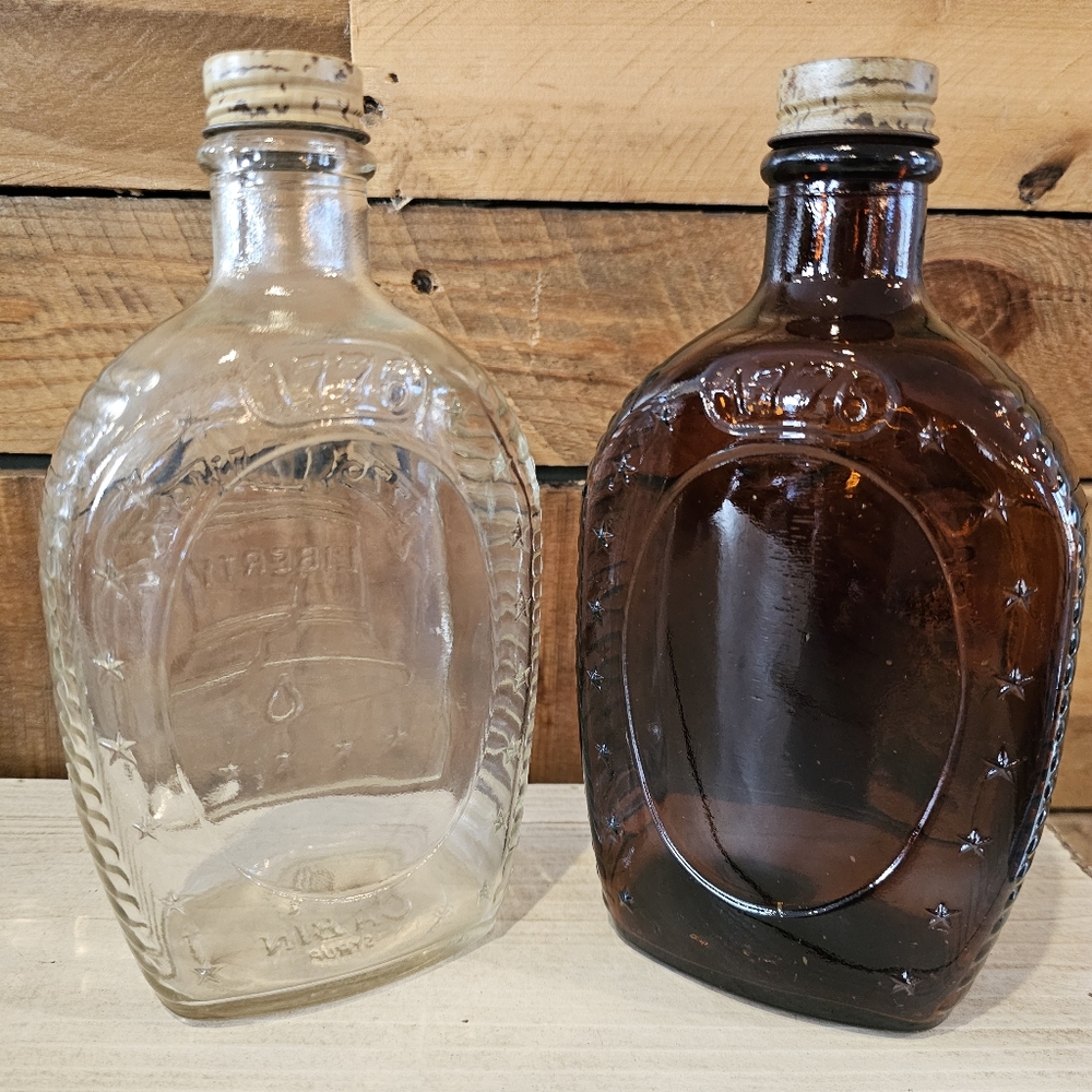 Two Vintage '76 Bicentennial Log Cabin Syrup Collectible Bottles Clear & Amber - Picture 2 of 8